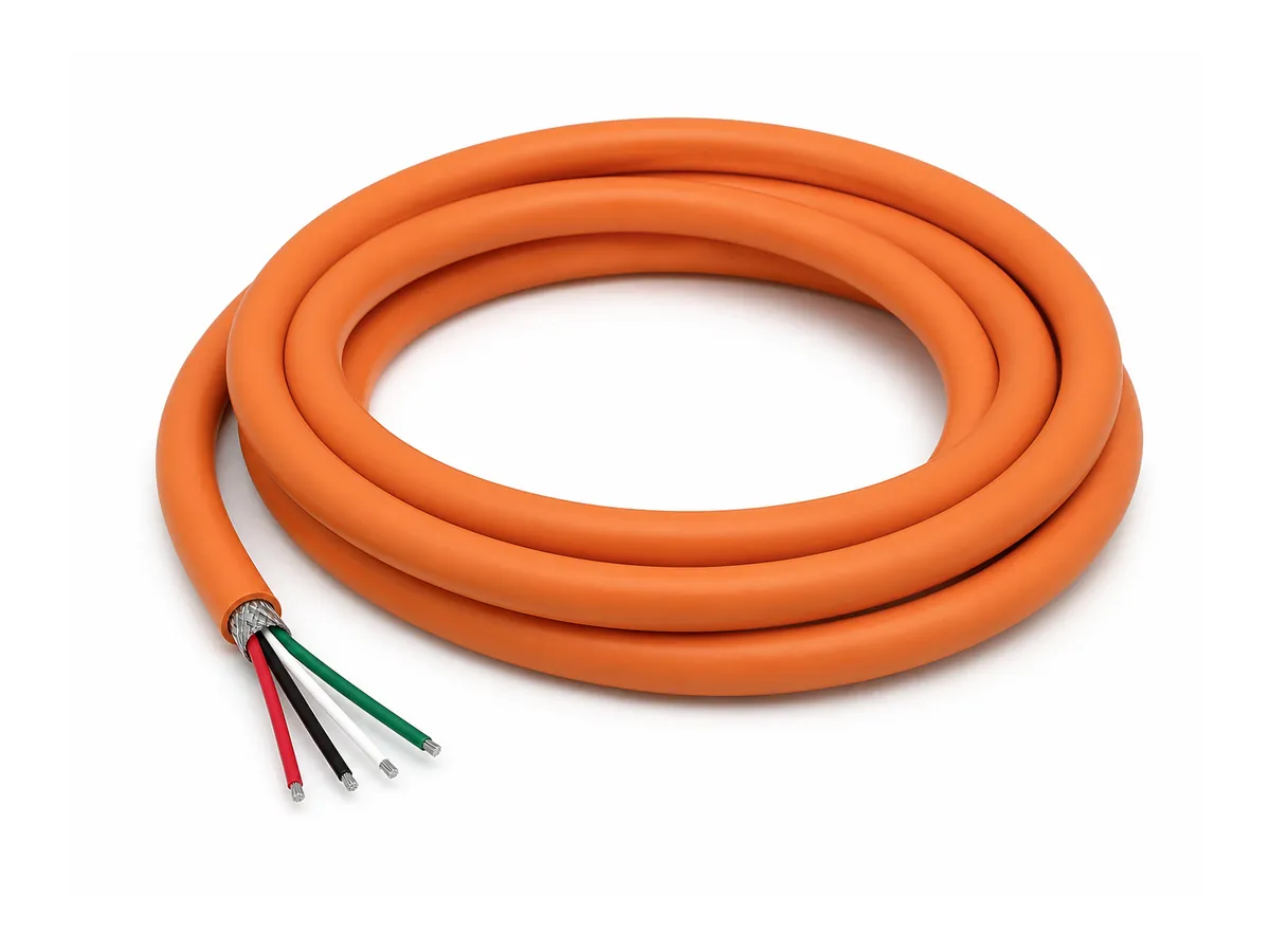 Coiled international core drag chain power cable on white background